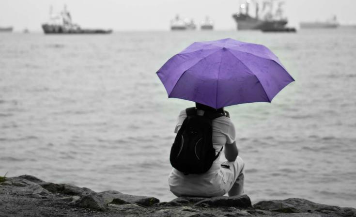 Lone person under an umbrella